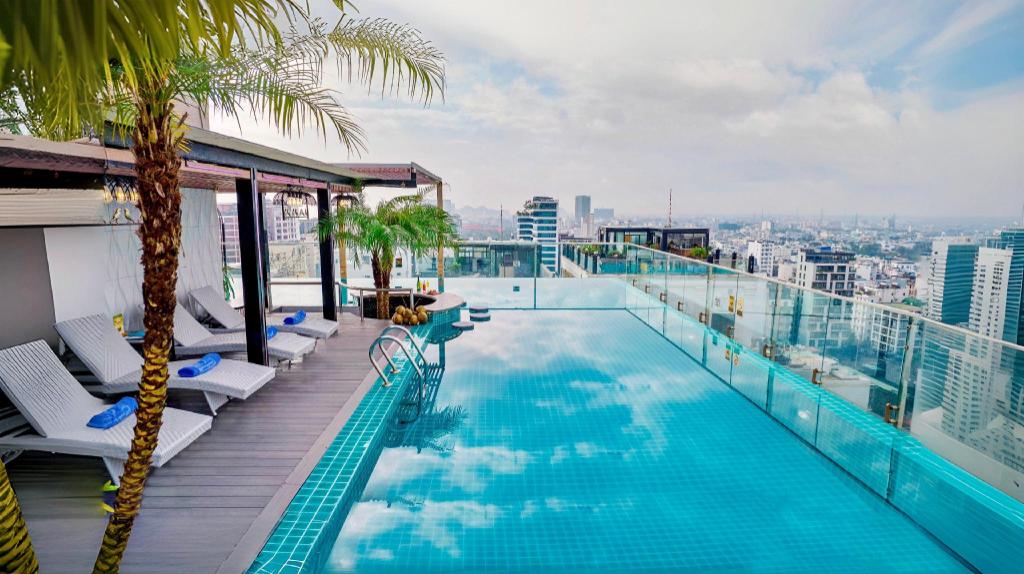 A swimming pool at Cicilia Danang Hotels & Spa, with the water looking toward the sea