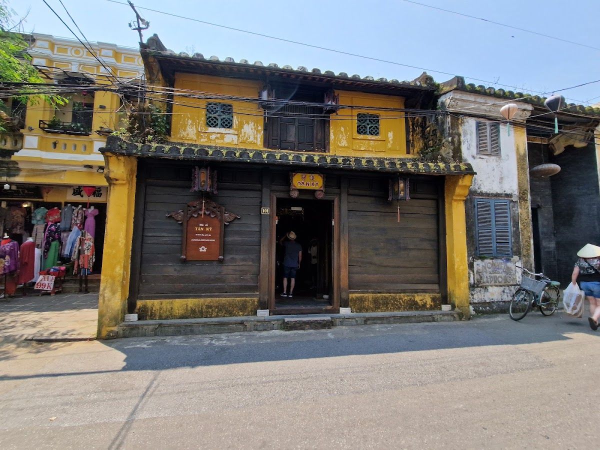 Tan Ky Ancient House facade in Hoi An Old Town — a 200-year-old merchant house with yellow walls and carved wooden doors