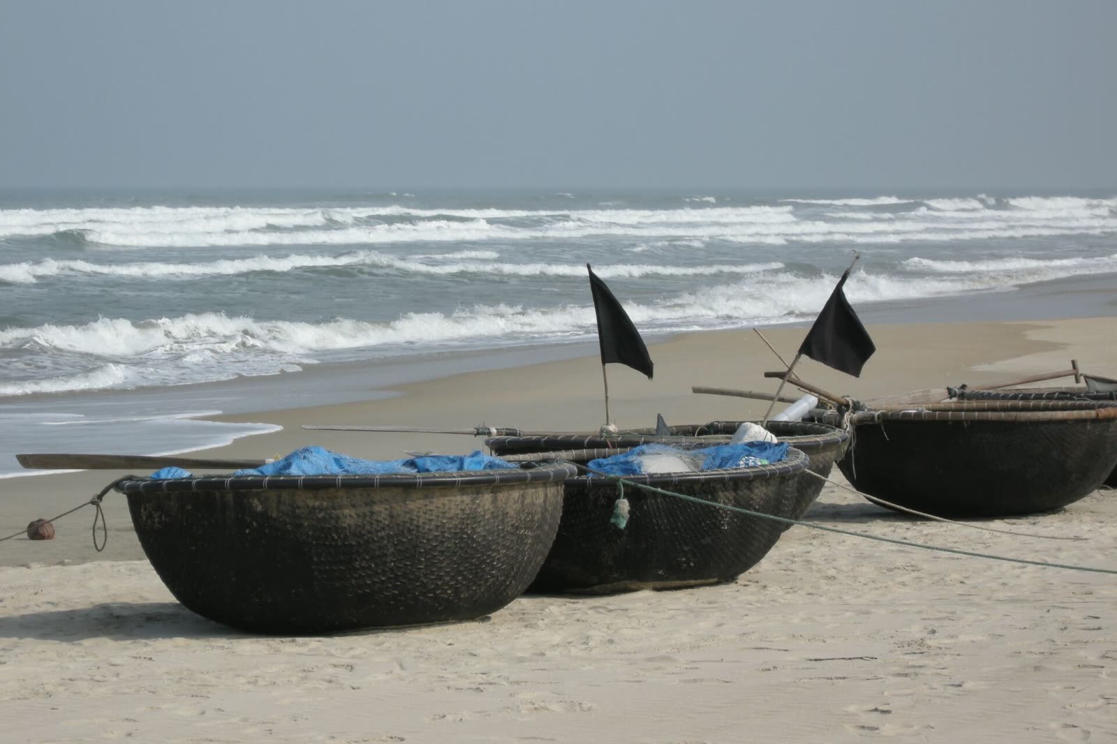 Round basket boats on the sand at Non Nuoc beach